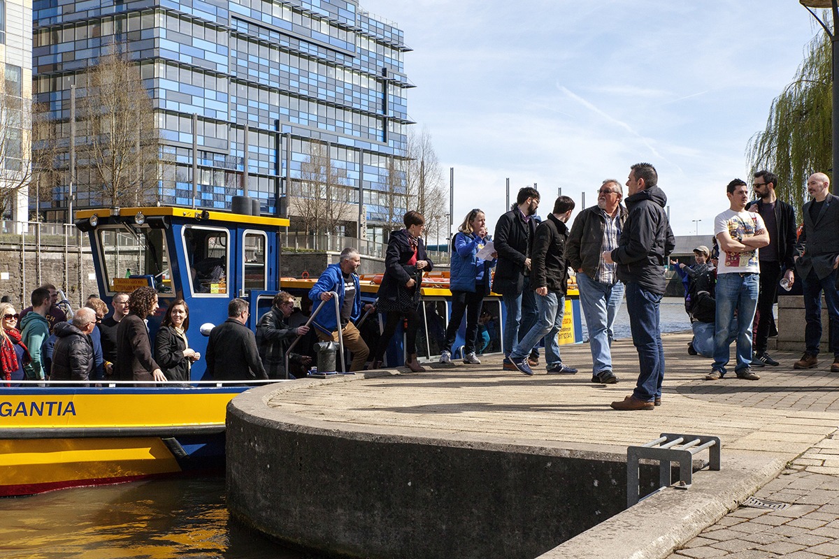 A Bristol Brewery Tours group raising glasses on the harbour boat